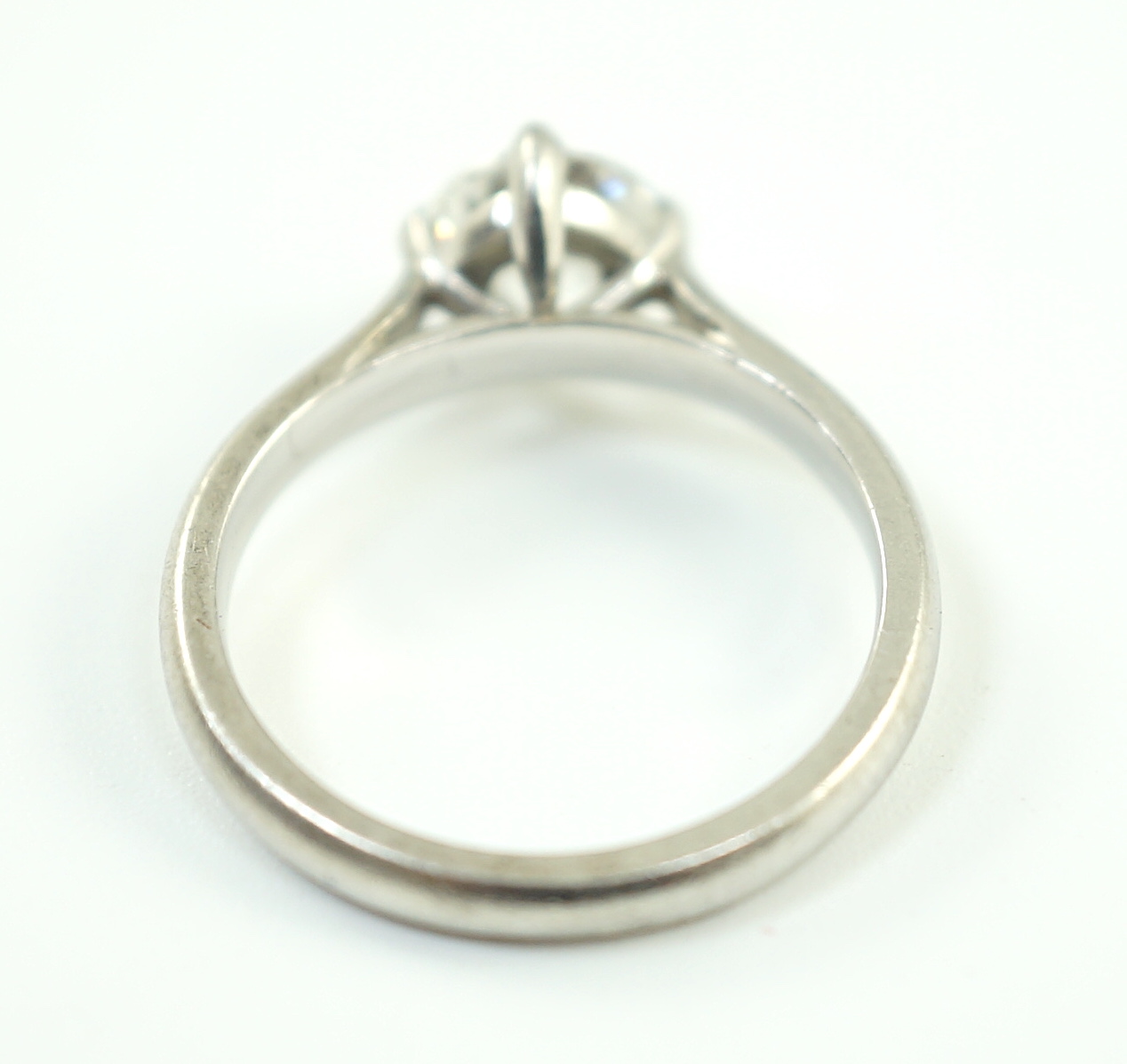 A modern platinum and solitaire diamond set ring